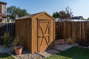 Backyard shed developed with hardscaping design