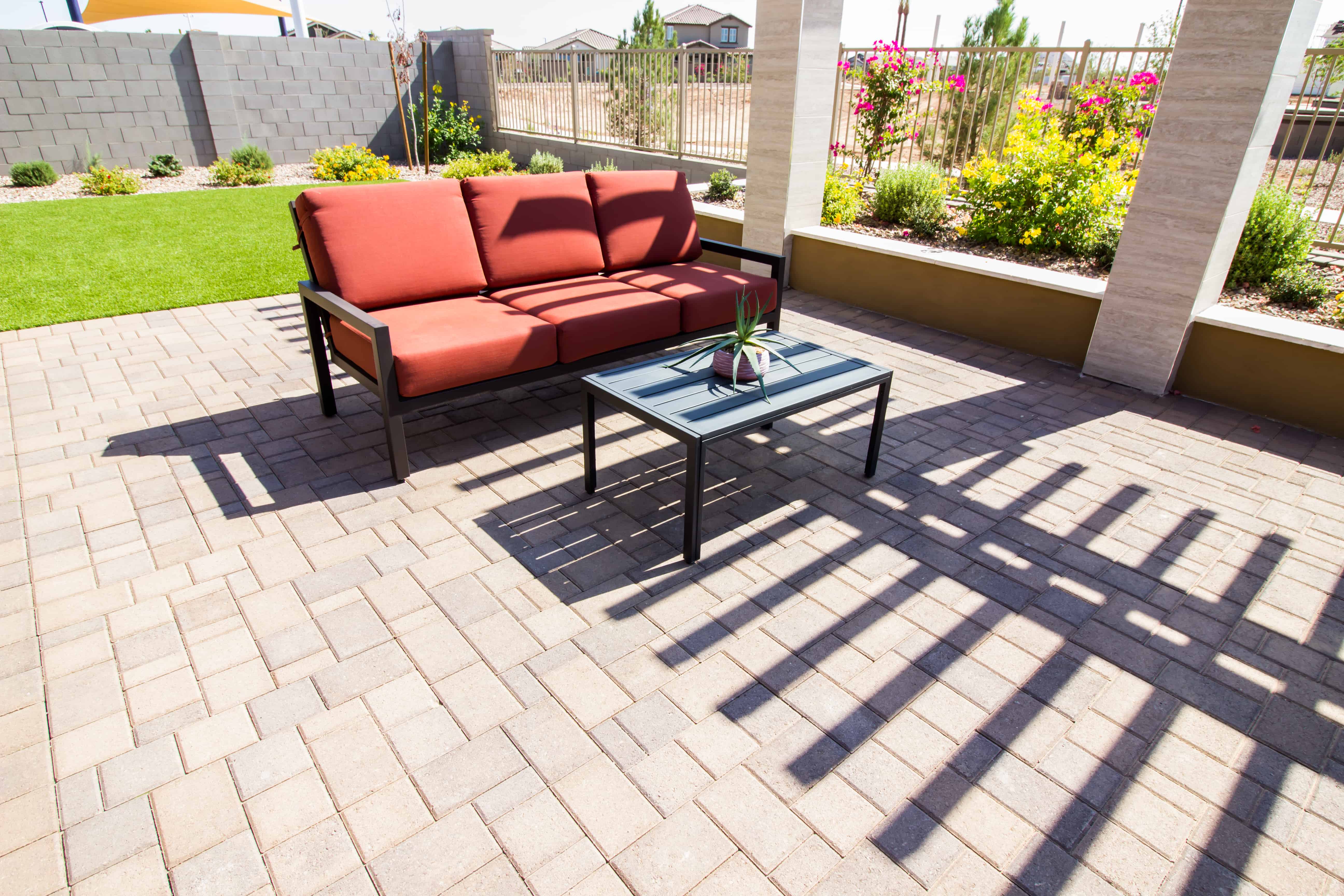 Elevate your patio design with Lawns & Beyond; contact us today for classic to unique paver patterns.
